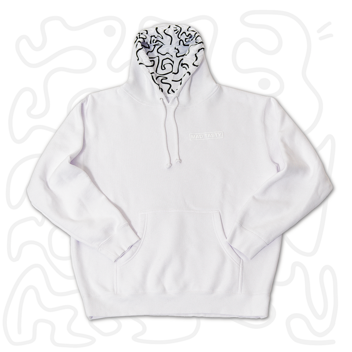 Cozy lined hoodie laid out  in white with a monochromatic raised MAD TASTY logo and hoodie lined with our signature squiggle line art.