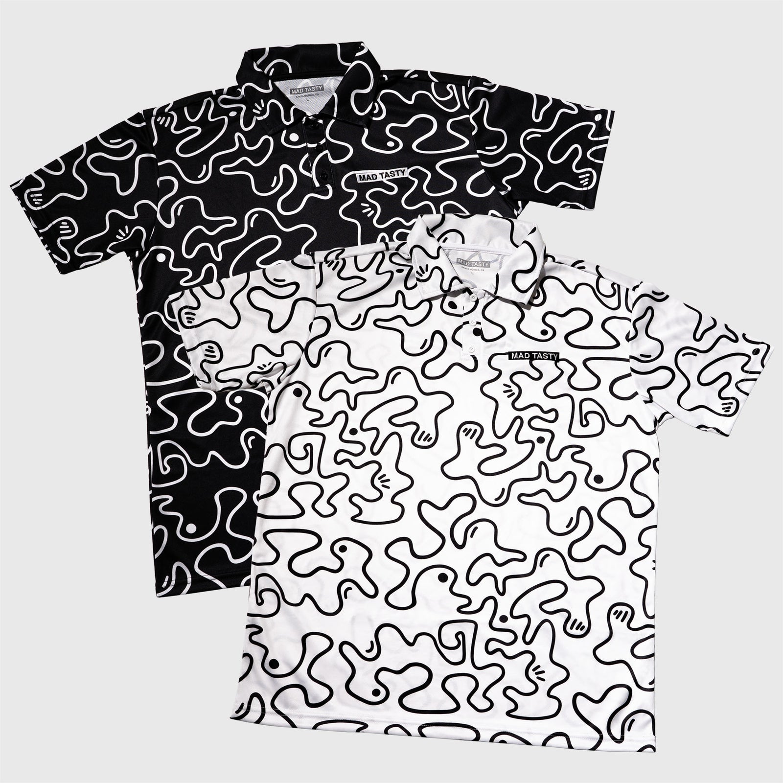 Black / White polo t-shirt, lightweight breathable fabric, squiggle graphic, and embroidered MAD TASTY logo in top right corner. 