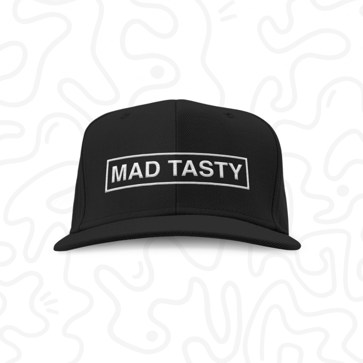 Baseball hat with MAD TASTY logo embroidered on front in white.